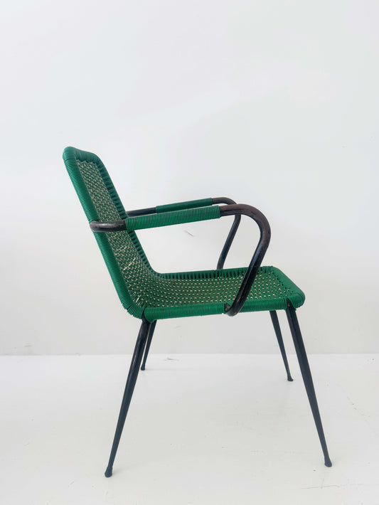 Green woven chair with armrests