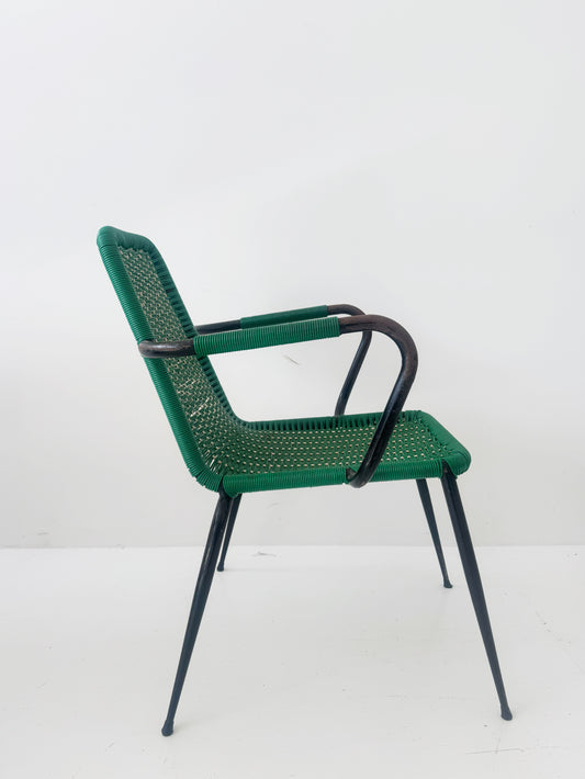 Green woven chair with armrests