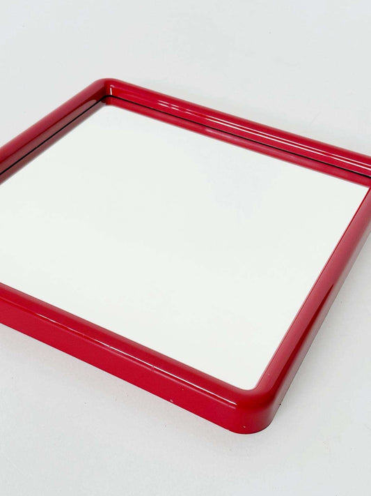 A pop-style wall mirror produced in the 1970s,