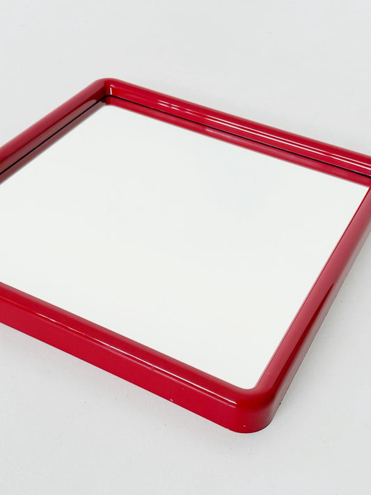 A pop-style wall mirror produced in the 1970s,