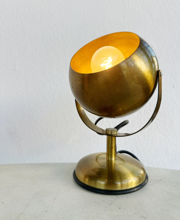 Brass eye table lamp