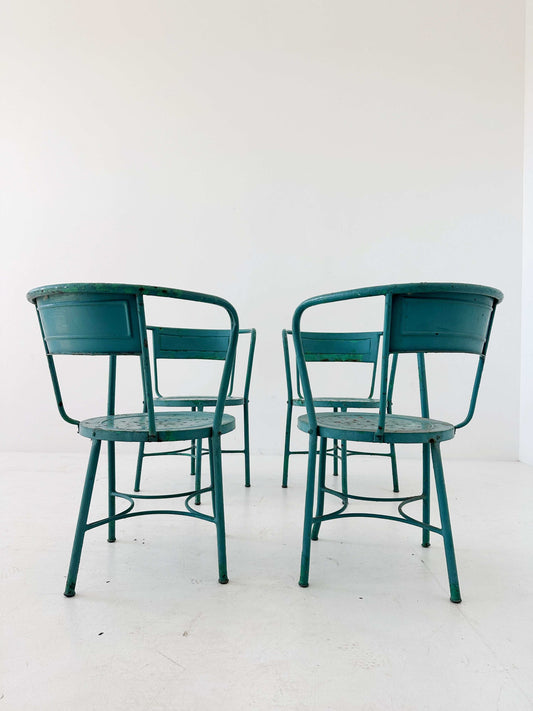 Set of four iron tub chairs