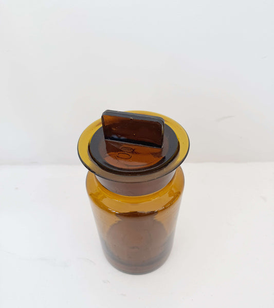 Vintage amber glass apothecary jar with cap