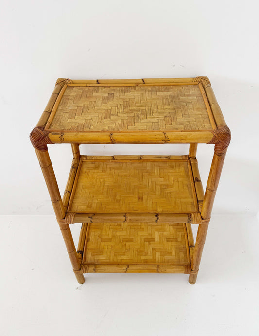 A 1970s bamboo bookcase with three shelves and woven details