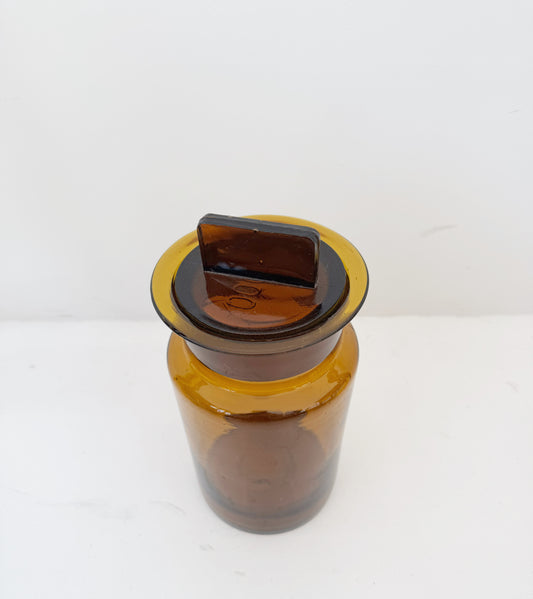 Vintage amber glass apothecary jar with cap