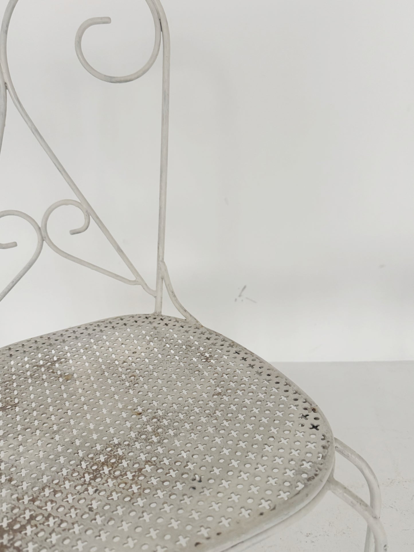 Pair of vintage wrought iron garden chairs