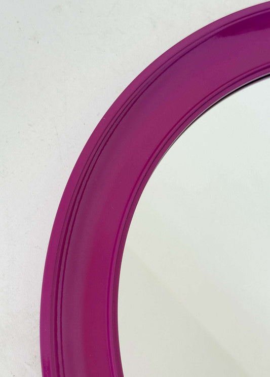 Round mirror with purple plastic frame