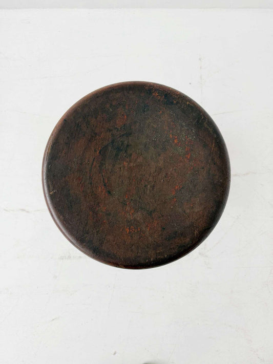 An adjustable industrial stool with a distinctly workshop/laboratory feel, boasting a strong, authentic presence.