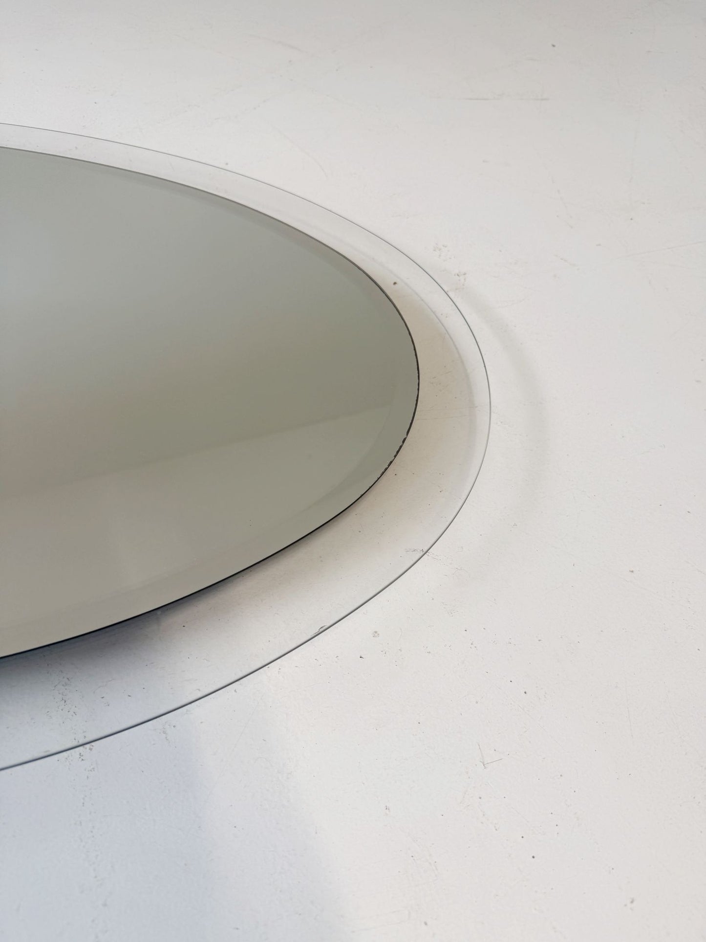 Oval mirror with clear glass frame (c. 1970s)