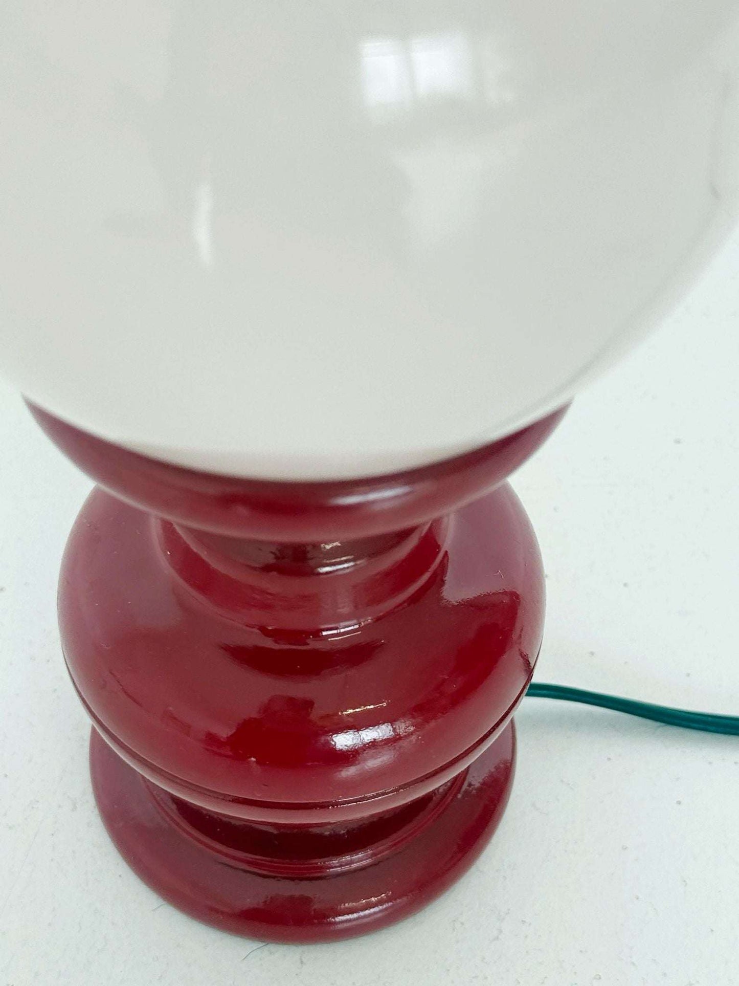Red wooden table lamp with pink sphere
