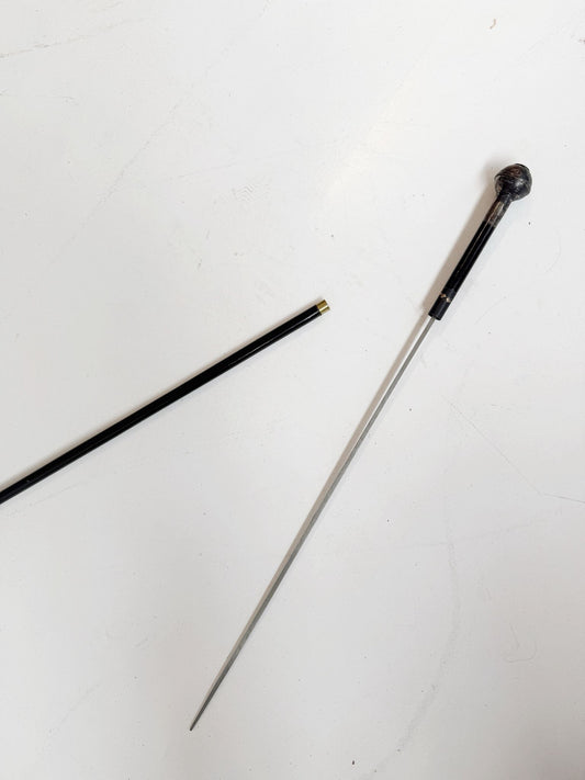 Cane with internal blade and military pommel, first half of the 20th century