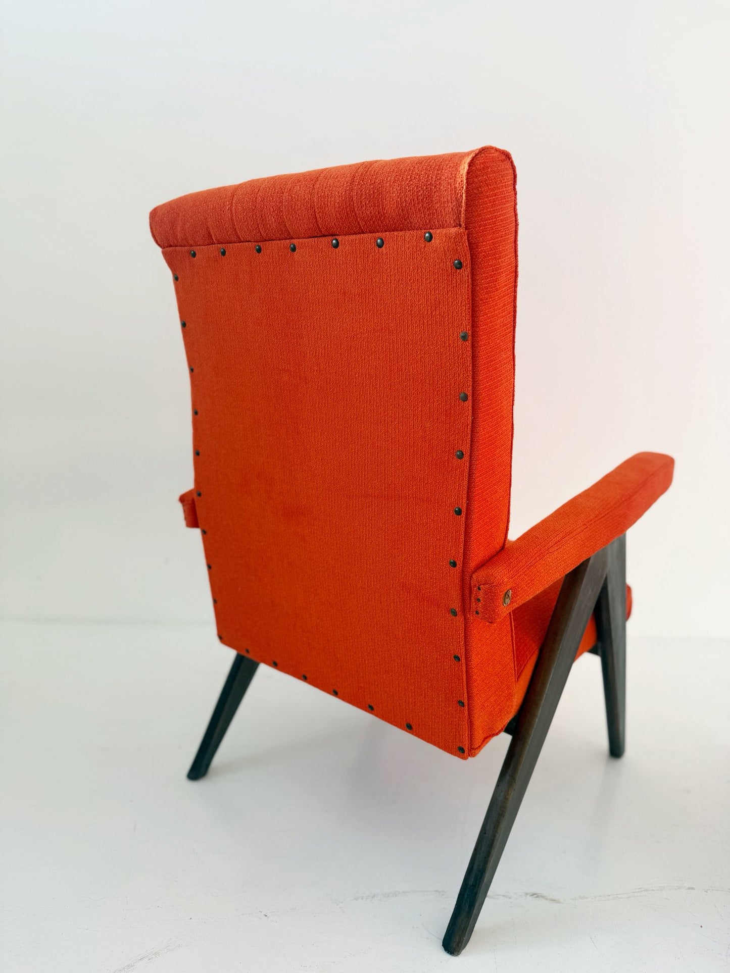 A pair of vintage reclining armchairs