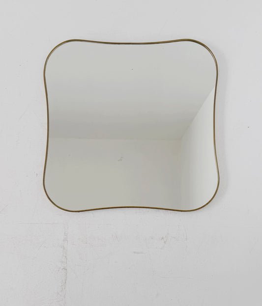 Shaped vintage mirror with a gold-tone frame