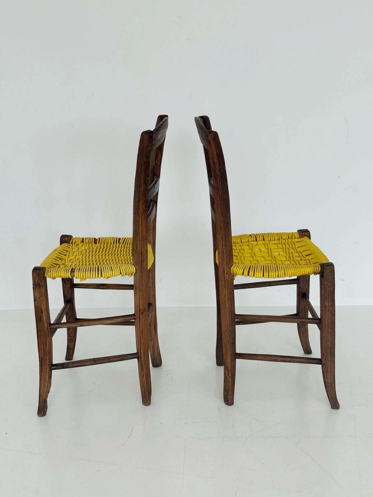 Pair of 1960s wooden chairs with yellow woven seat