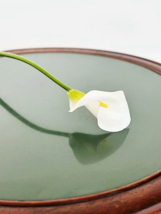 Round table with green glass top