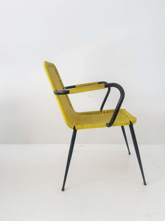 Yellow woven chair with armrests