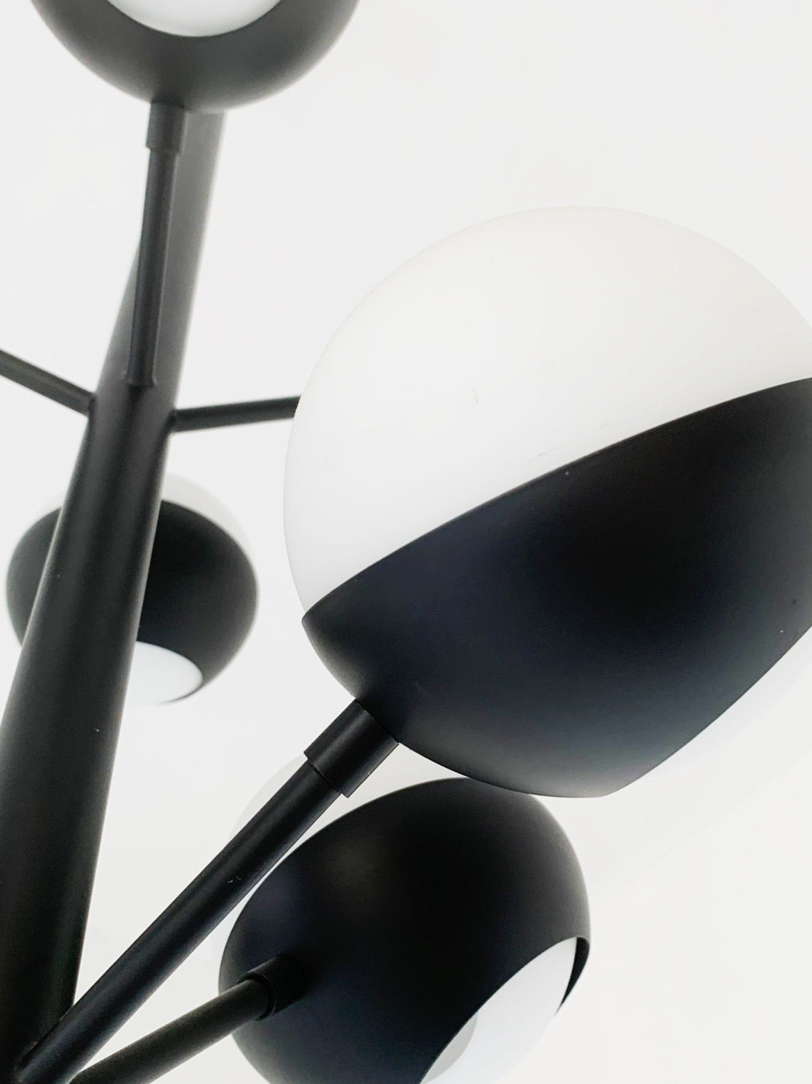 Black chandelier with glass spheres