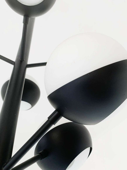 Black chandelier with glass spheres