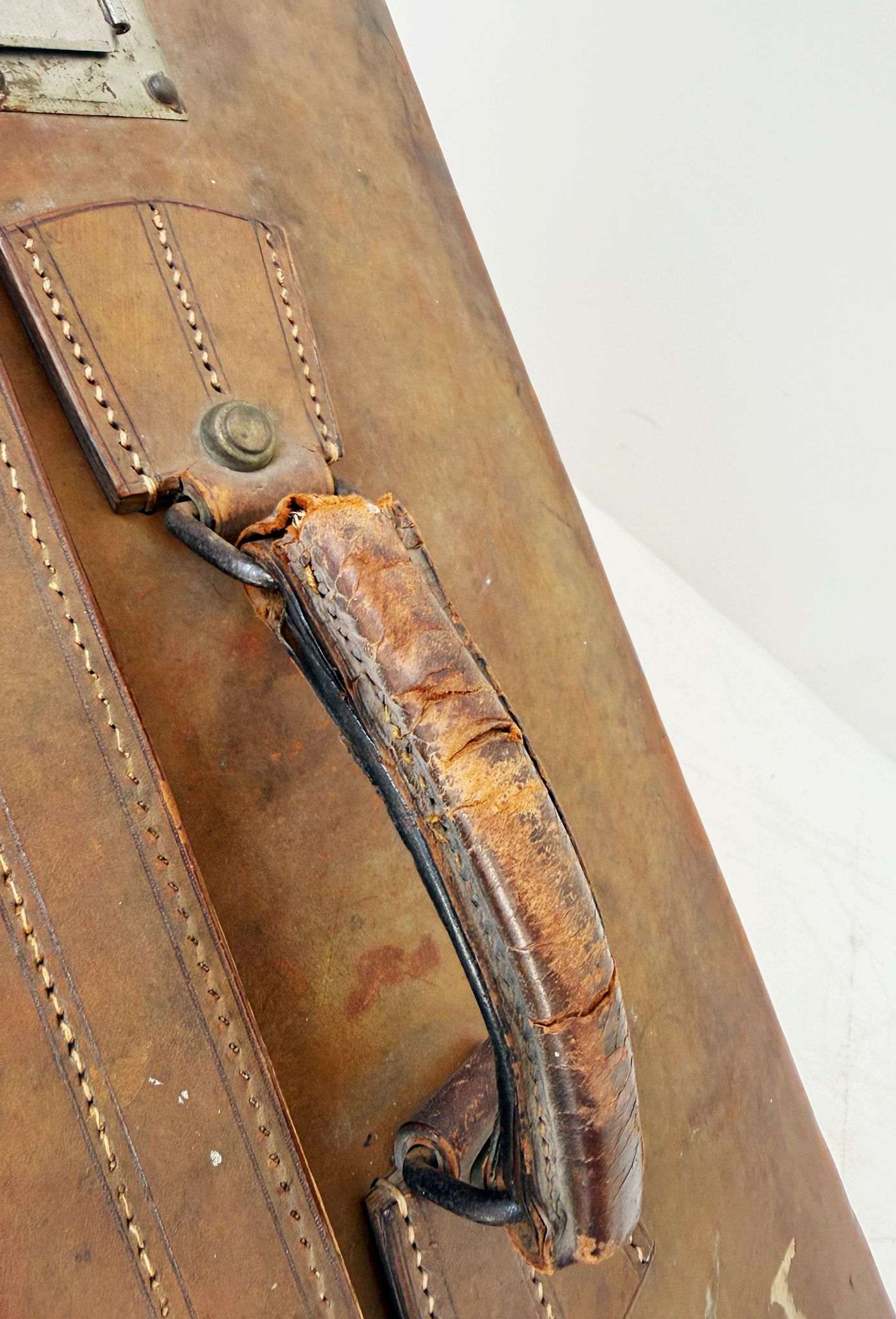 Leather travel suitcase with hotel labels