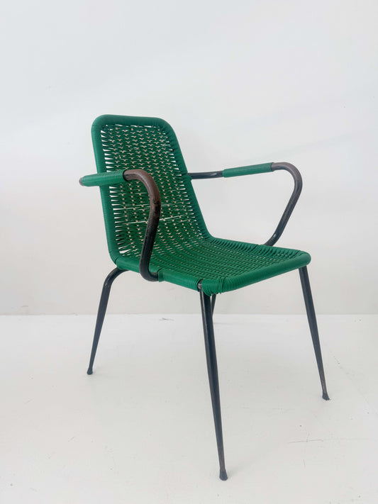 Green woven chair with armrests