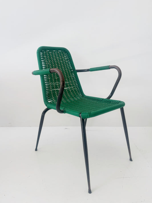 Green woven chair with armrests