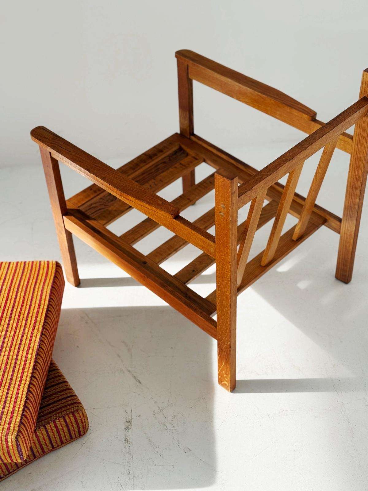 Solid wood armchair with striped upholstery