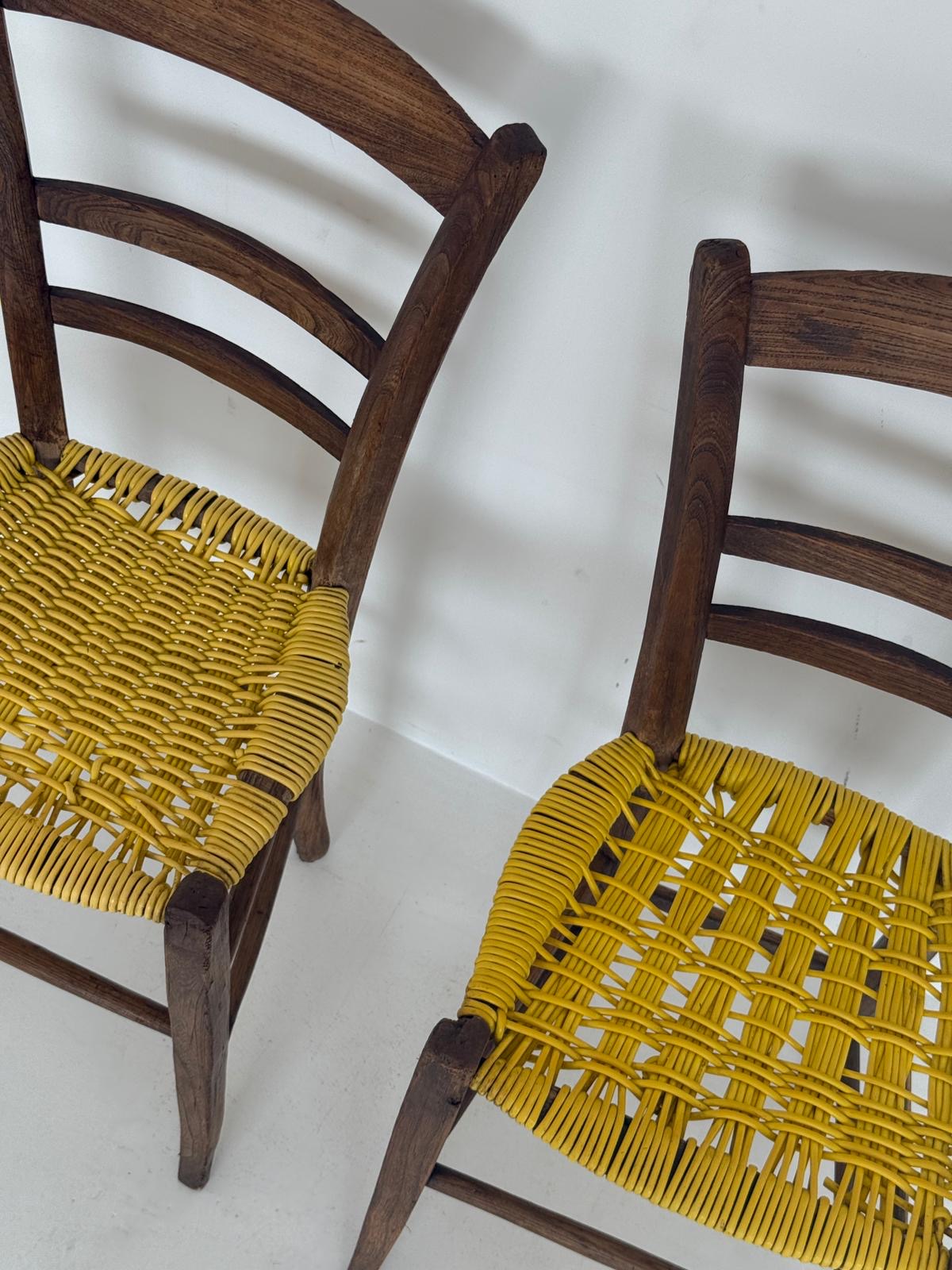 Pair of 1960s wooden chairs with yellow woven seat