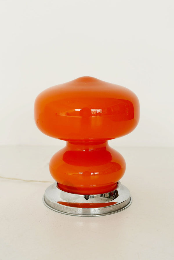 orange table lamp with chrome base