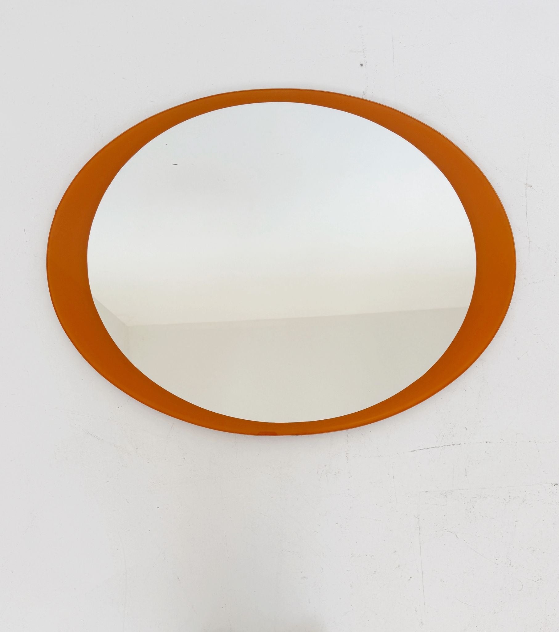 Oval mirror with orange back-painted glass frame, 1970s