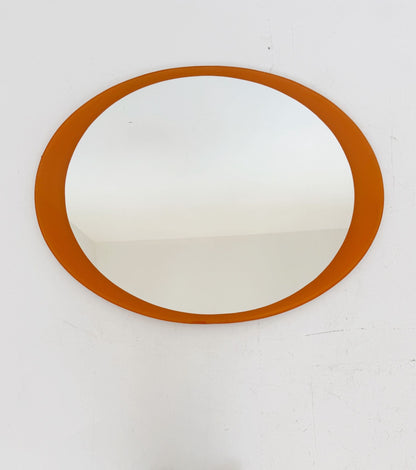 Oval mirror with orange back-painted glass frame, 1970s