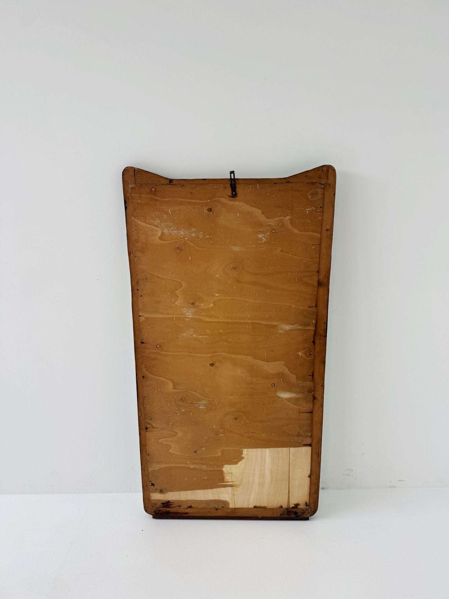 Shaped wall mirror with wooden edge
