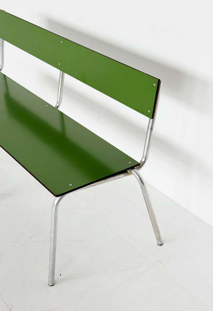 Green metal bench with tubular structure