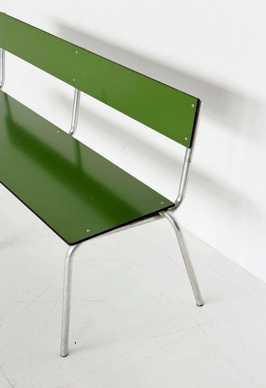 Green metal bench with tubular structure