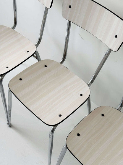 Three beige formica chairs