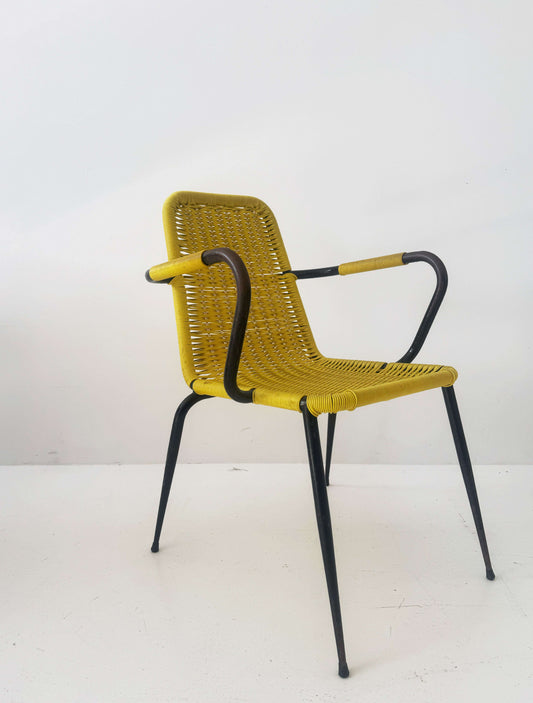 Yellow woven chair with armrests