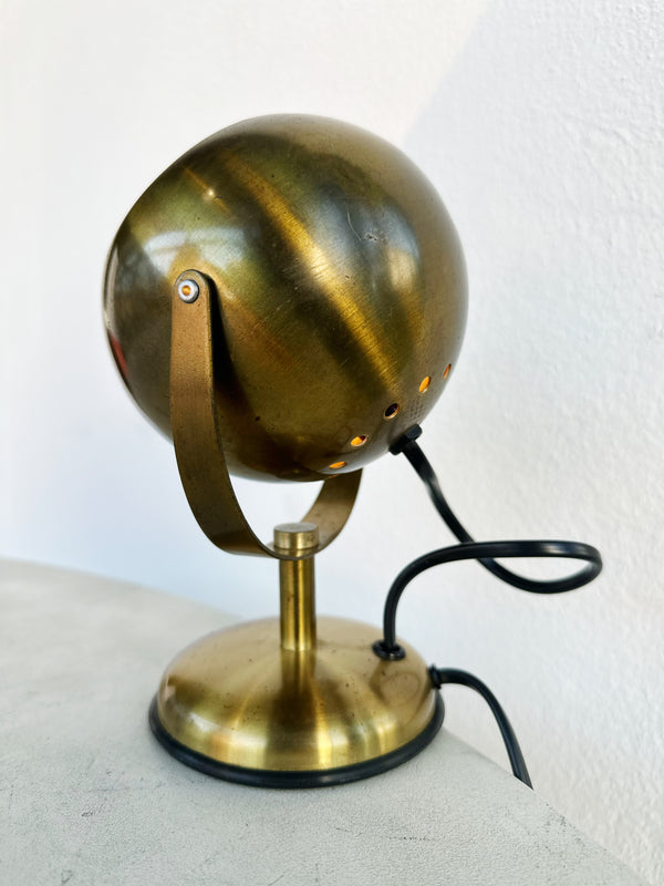 Brass eye table lamp