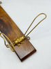 Brass and wood clothes hanger