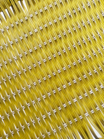 Yellow woven chair with armrests