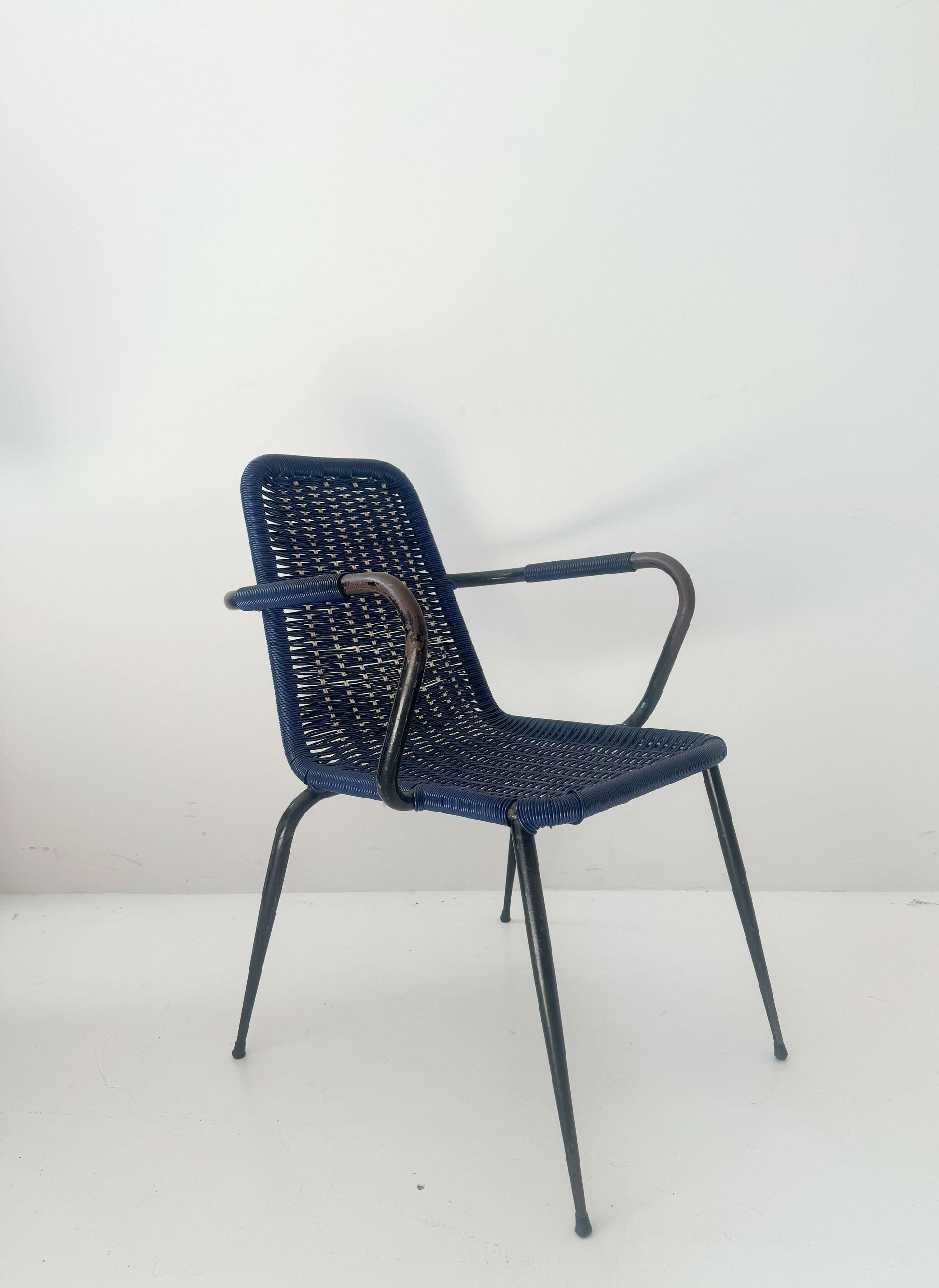 Blue woven chair with armrests
