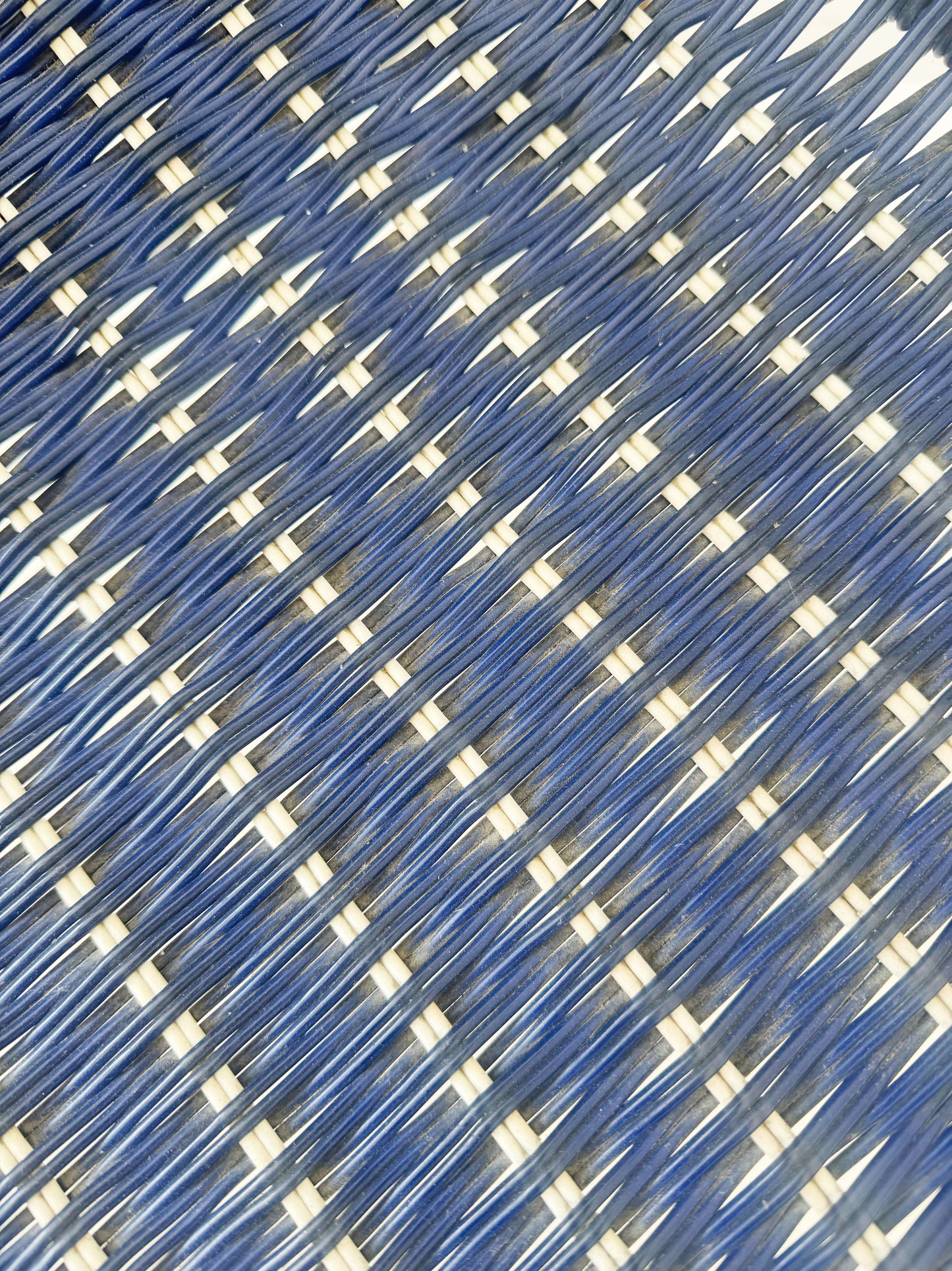 Blue woven chair with armrests