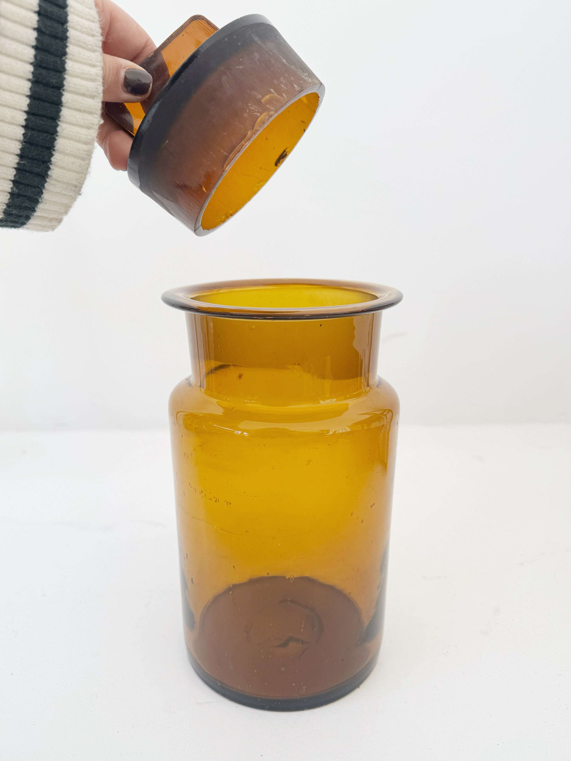 Vintage amber glass apothecary jar with cap