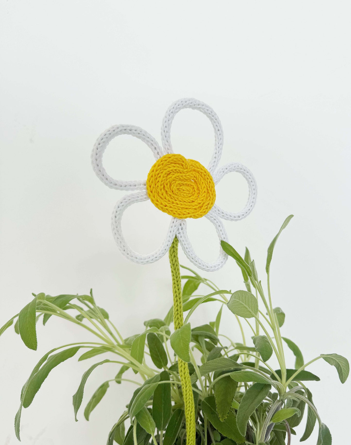 Floral tricotin plant topper – handmade decoration