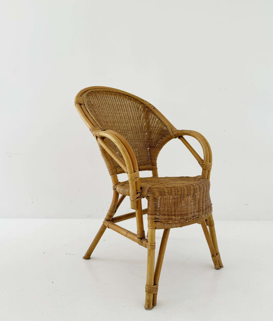 Woven rattan armchair