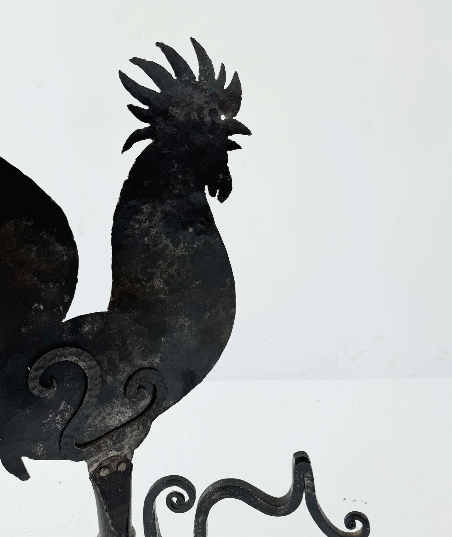Decorative iron rooster-shaped weathervane
