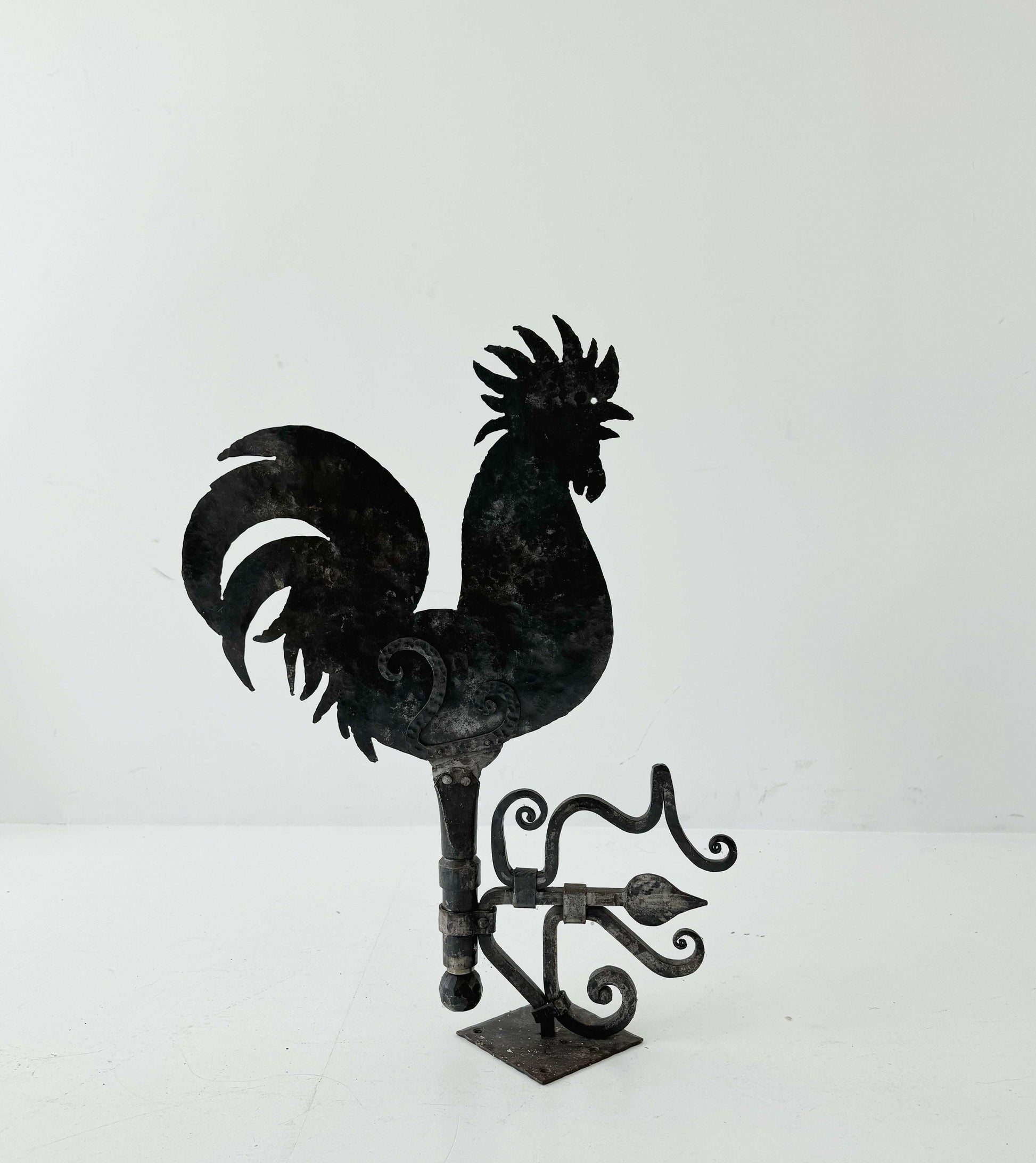 Decorative iron rooster-shaped weathervane