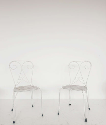 Pair of vintage wrought iron garden chairs