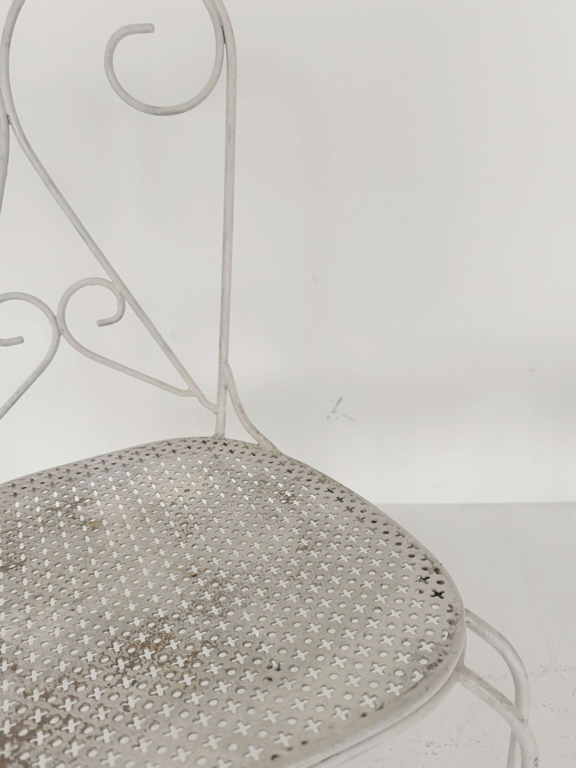 Pair of vintage wrought iron garden chairs