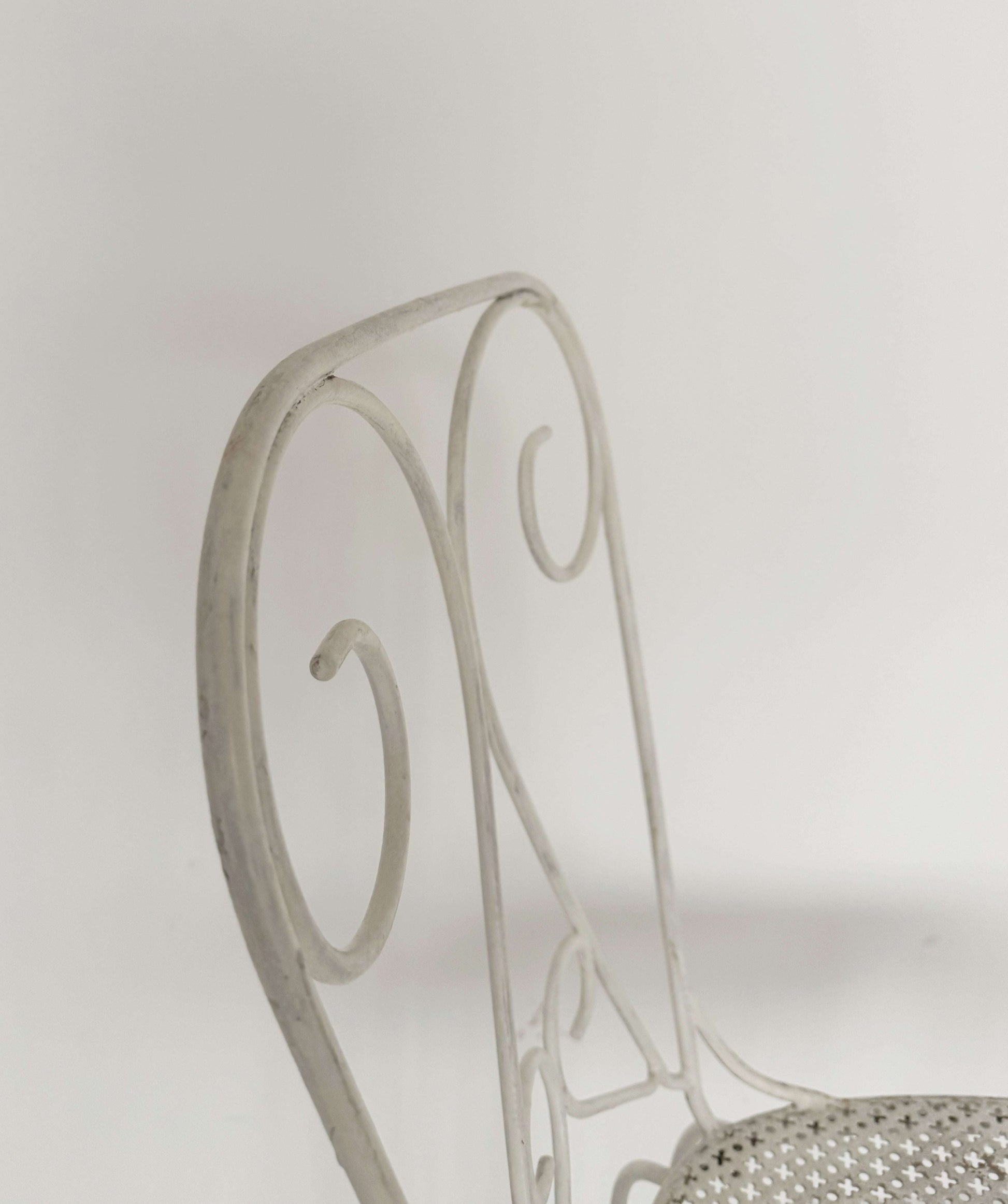 Pair of vintage wrought iron garden chairs