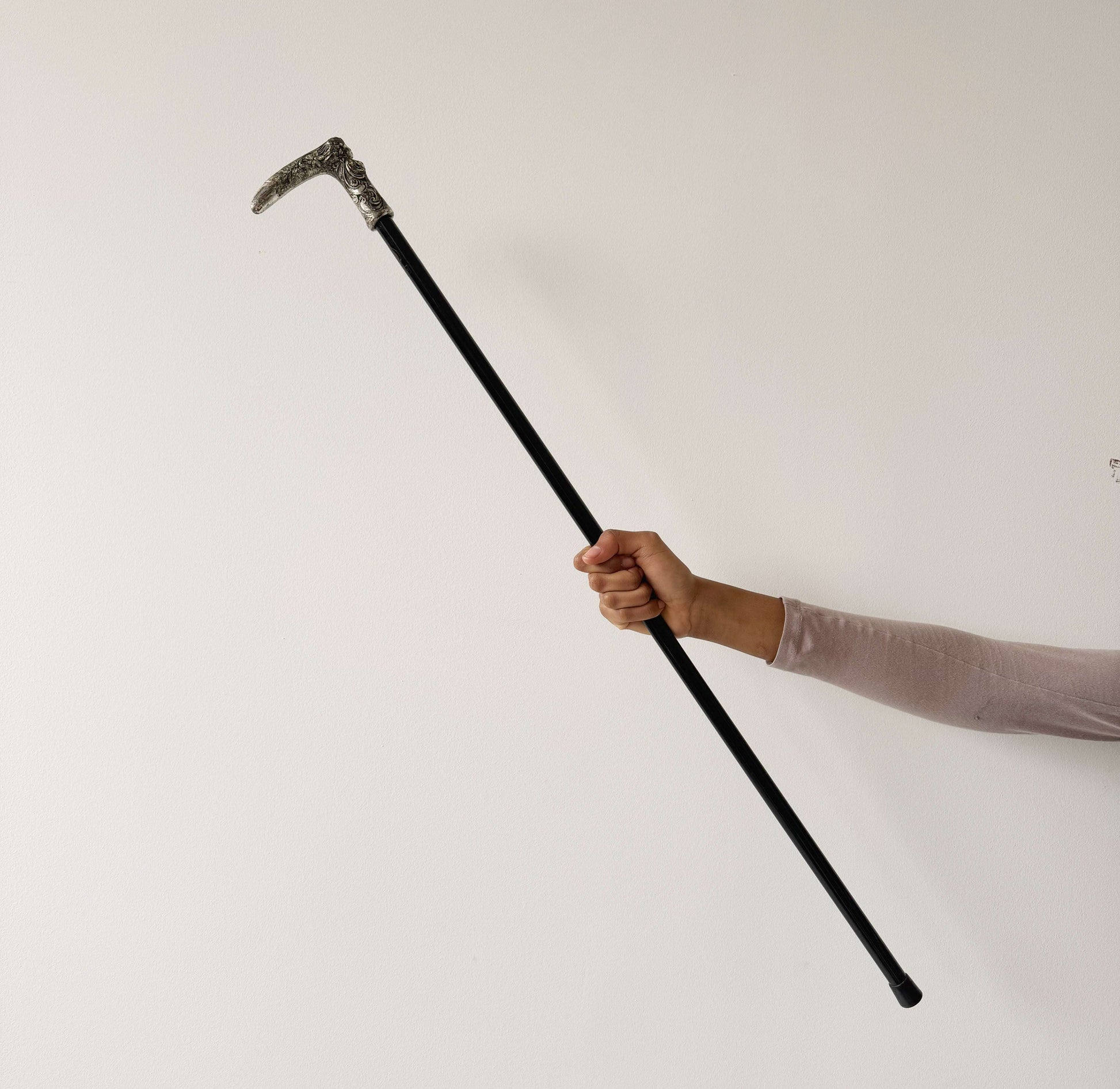 Walking stick with decorated metal handle