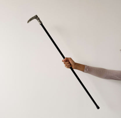 Walking stick with decorated metal handle